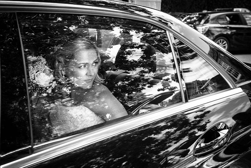 Bride in wedding car at London wedding
